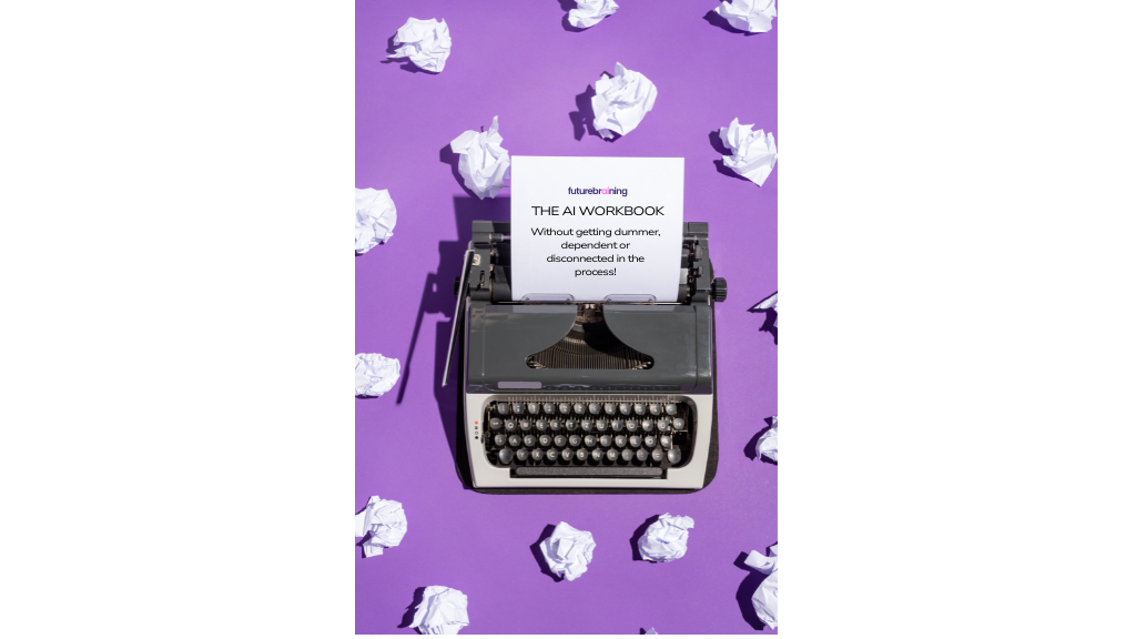 A vintage black typewriter sits centered on a bright purple background. A sheet of paper in the typewriter reads: &ldquo;futurebraining &mdash; AI WORKBOOK &mdash; Without getting dumber, dependent or disconnected in the process!&rdquo; Crumpled sheets of white paper are scattered around, suggesting multiple failed drafts and the persistence of revision.